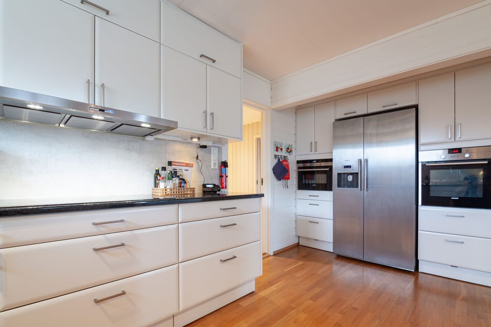 The kitchen is modern and spacious and has everything you need to prepare meals.