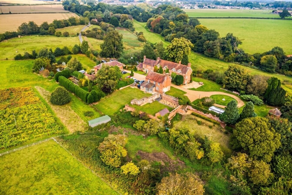 Sweeping country estate set among rolling fields and private gardens
