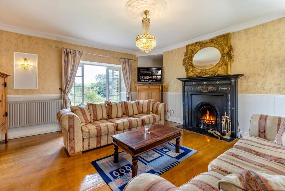 Second sitting room with countryside views and a warming open fire