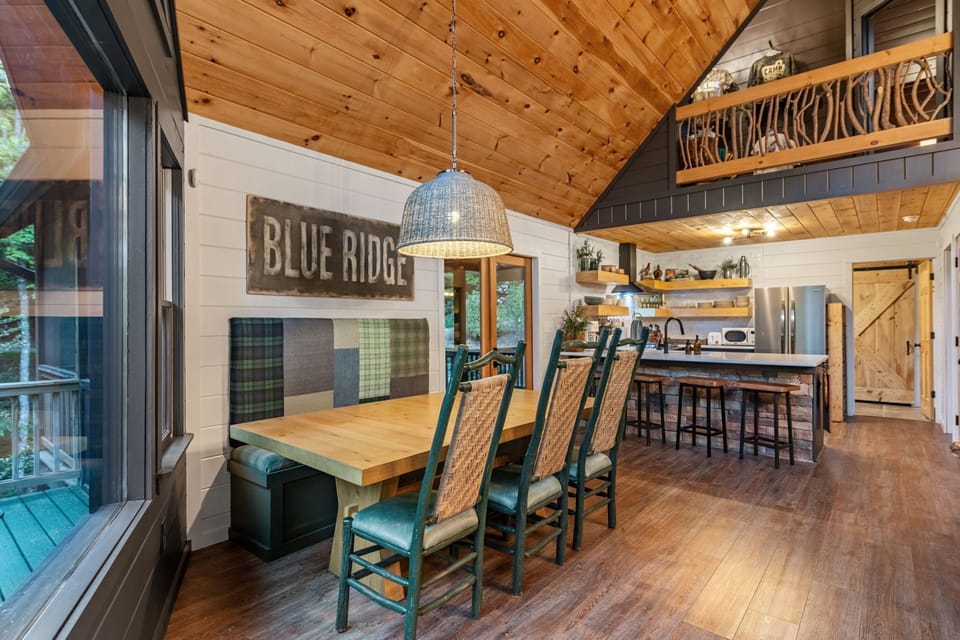 Gather around a dining table filled with thoughtful little touches. Patchwork textures, cozy décor, and the warm feeling of sharing meals together in the mountains.