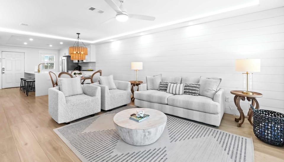 Living room: 65" Smart TV, electric fireplace, beach view, balcony