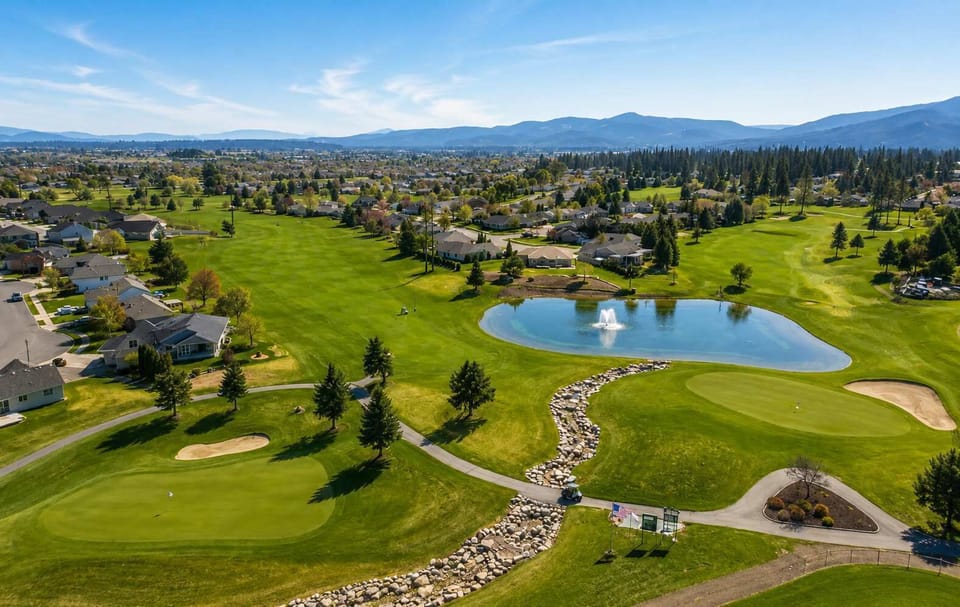 Scenic aerial view showcasing the beautiful golf course and surrounding neighborhood.