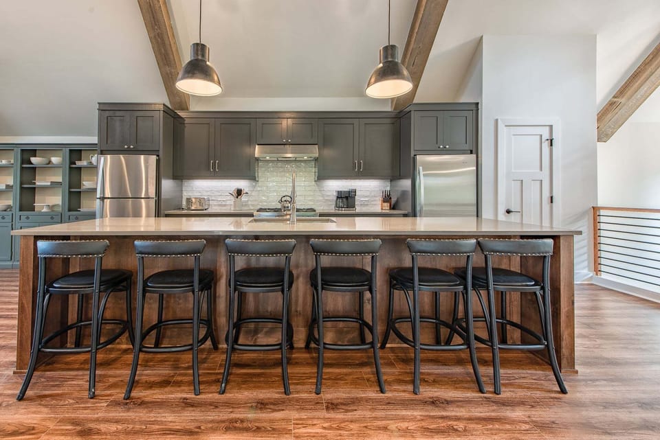 Fully stocked kitchen with large island seating 6.