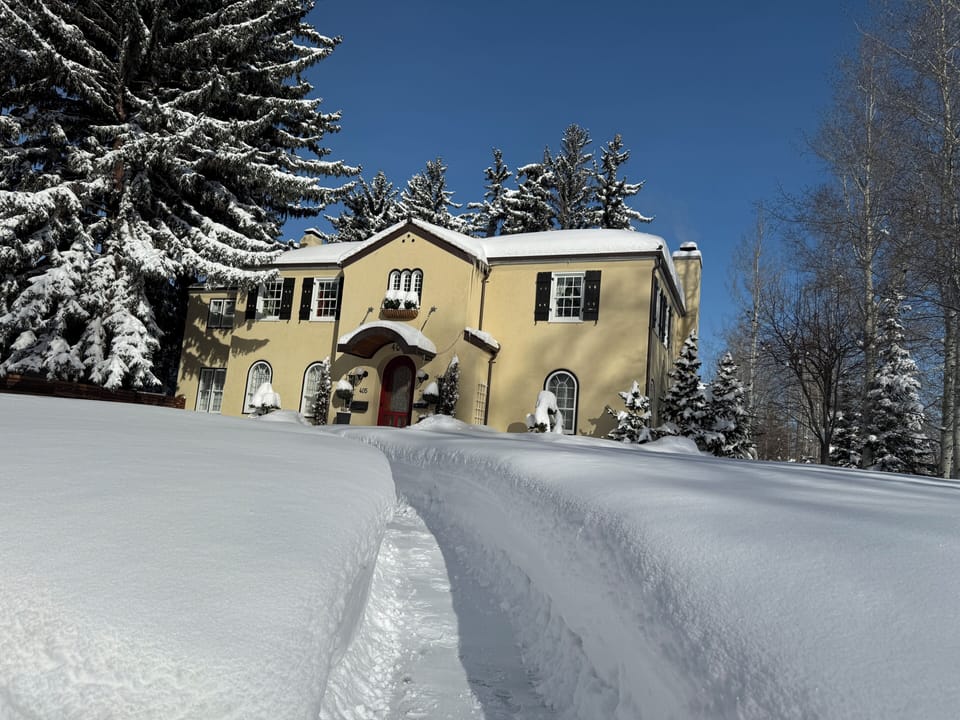 Front of home on a snowy day in winter