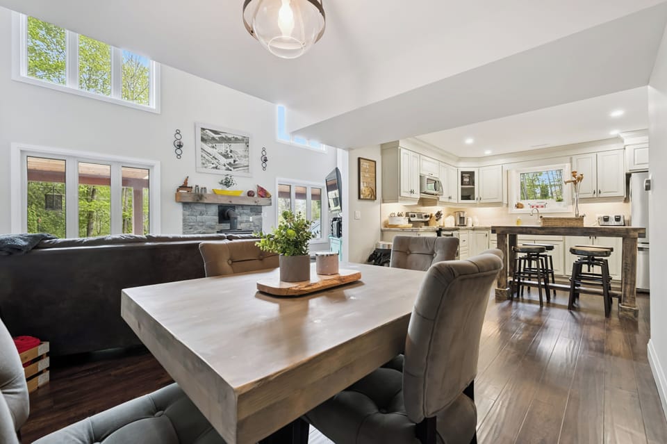 The open dining area flows seamlessly into the living room and kitchen, creating the perfect space for meals and conversation.