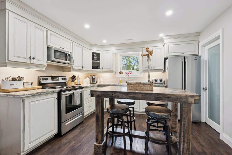 The spacious kitchen island is the perfect spot for morning coffee, meal prep, or catching up with family and friends.