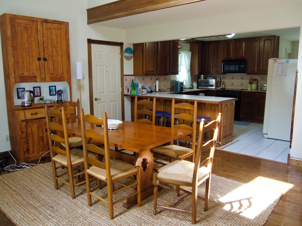 Dining Room with 6 chairs and counter space that seats 4. 