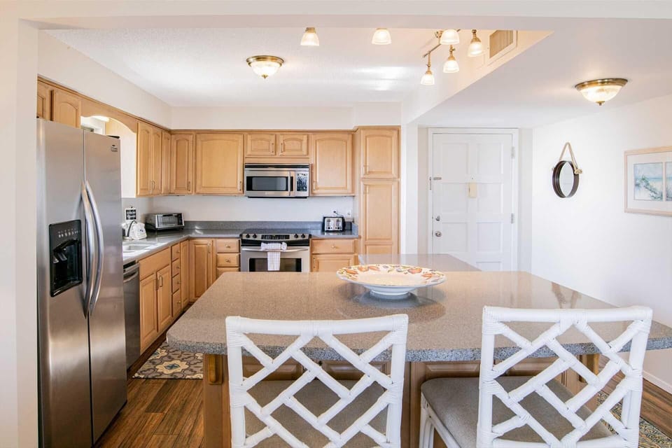 Bright, modern kitchen with spacious island seating for gatherings