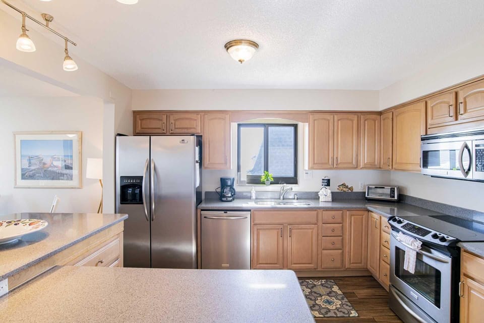 Bright, spacious kitchen with modern stainless steel appliances