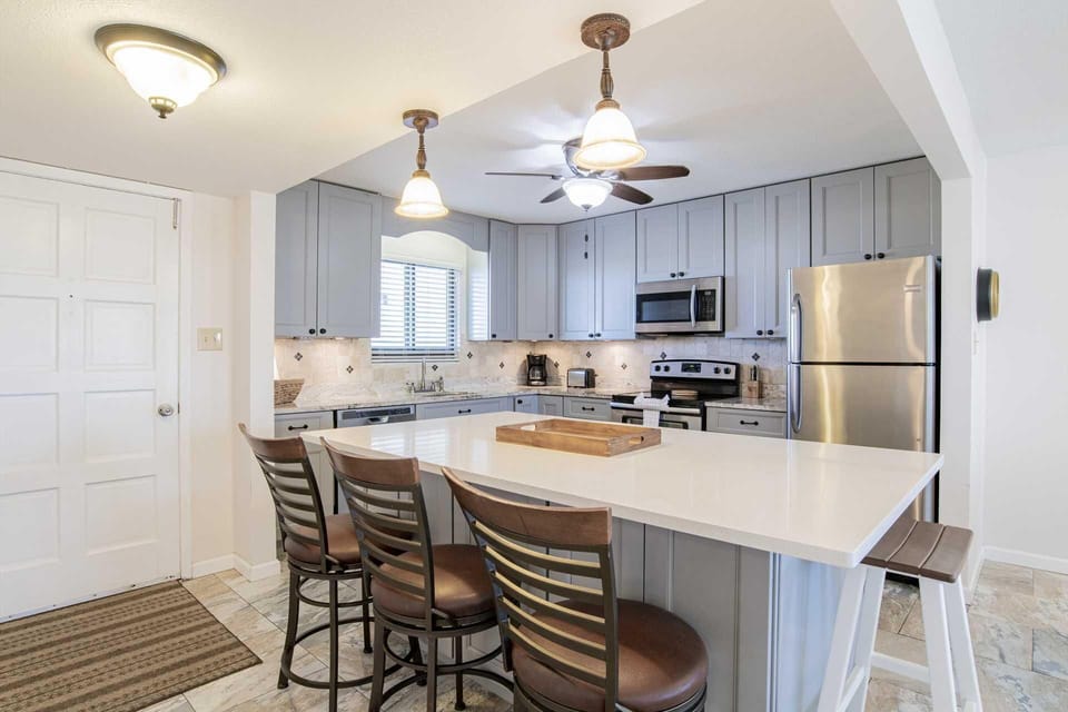 Bright, modern kitchen with spacious island seating for gatherings