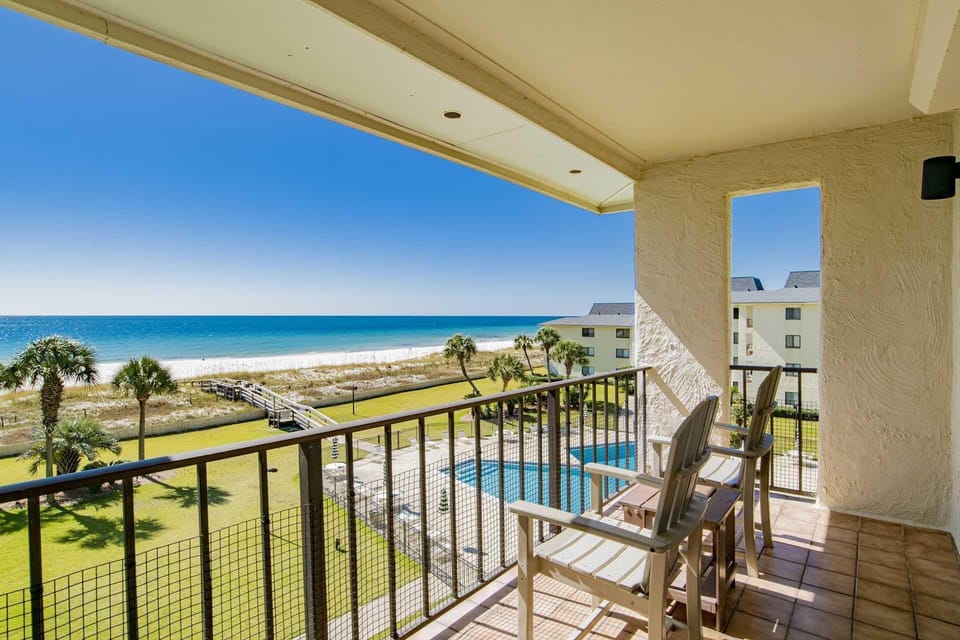 Oceanfront balcony with rocking chairs and stunning views