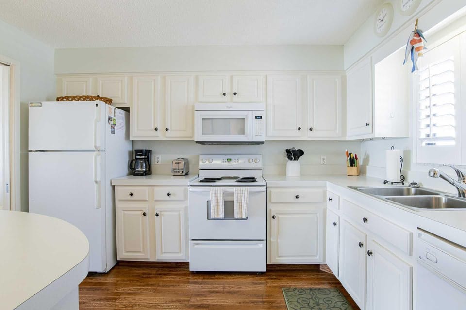 Bright, airy kitchen with modern appliances and cozy charm