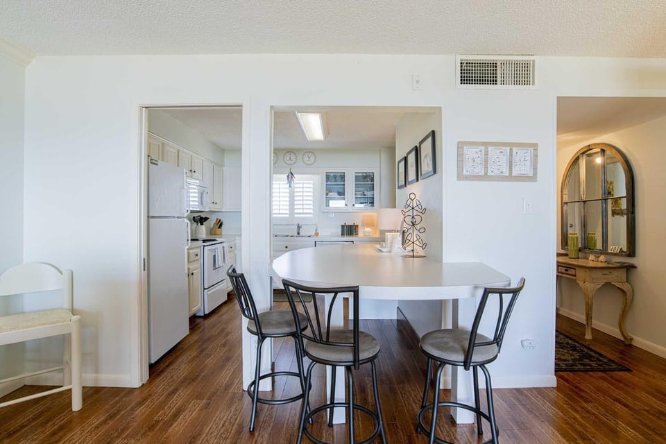 Bright and airy kitchen with cozy breakfast nook seating
