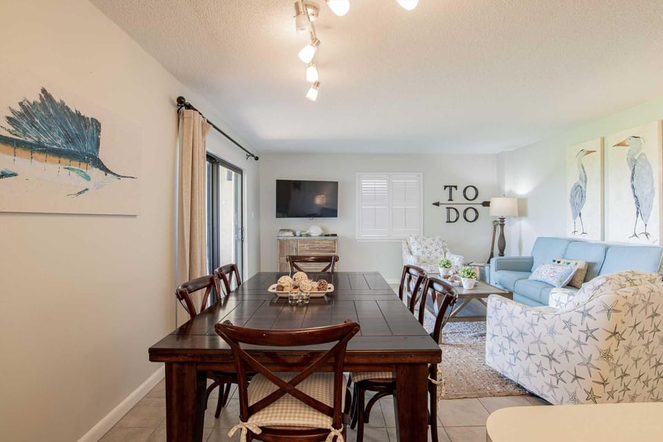 Bright and airy dining area flowing into cozy living space