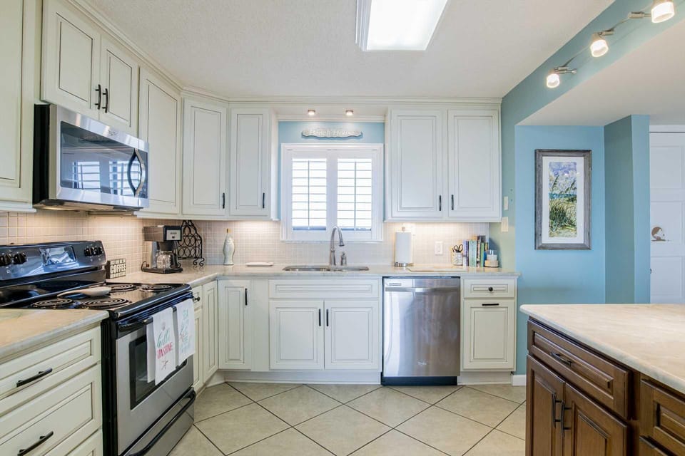 Bright, modern kitchen with stainless steel appliances and cozy charm