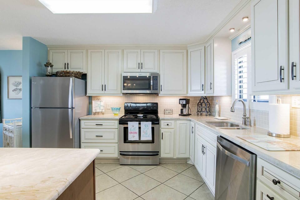 Bright, modern kitchen with stainless steel appliances and ample counter space
