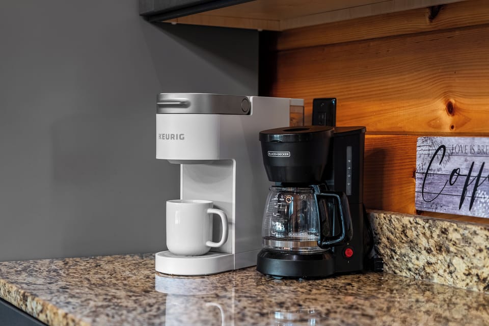 The kitchen is equipped with a Keurig and a drip maker.