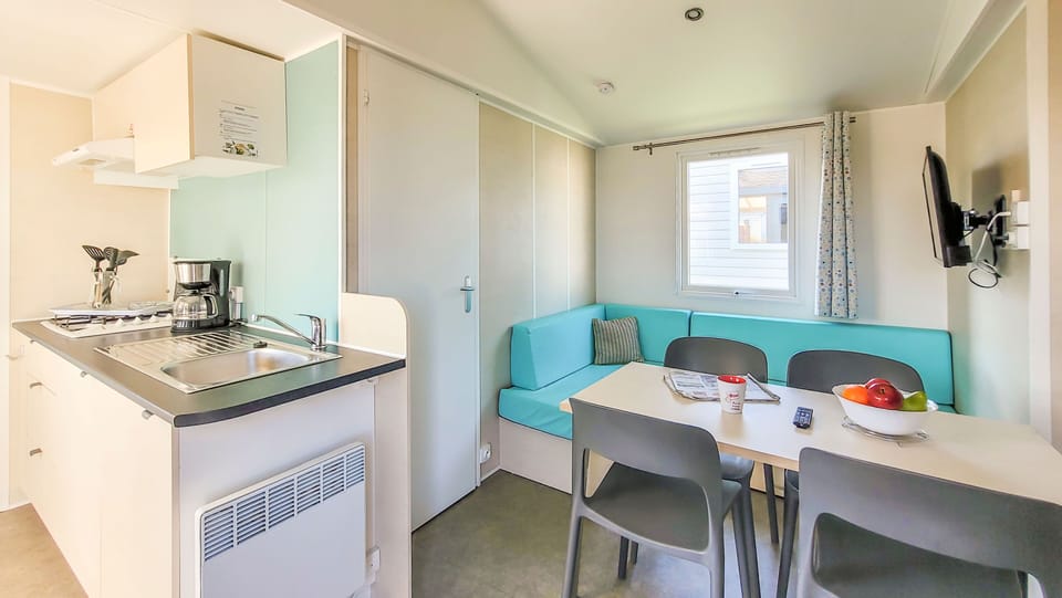 A bright and functional living area showcasing modern comforts, where families can unwind and create lasting memories.