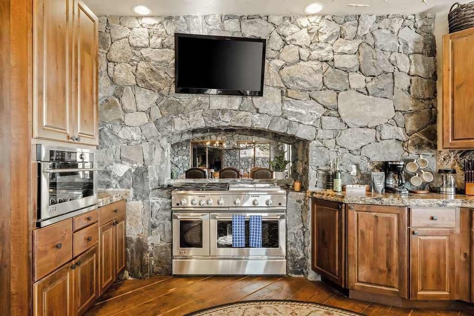 Luxe open kitchen with high-end stainless steel appliances