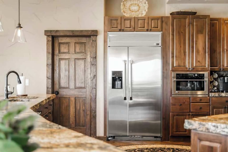Luxe open kitchen with high-end stainless steel appliances