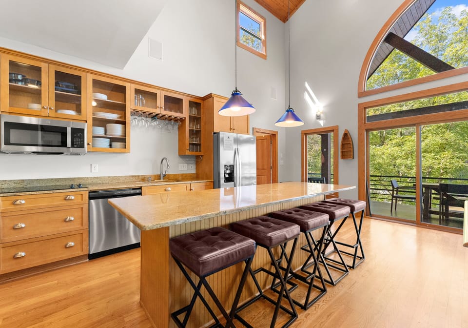 Fully stocked kitchen to prep all your group meals with island seating for 5.