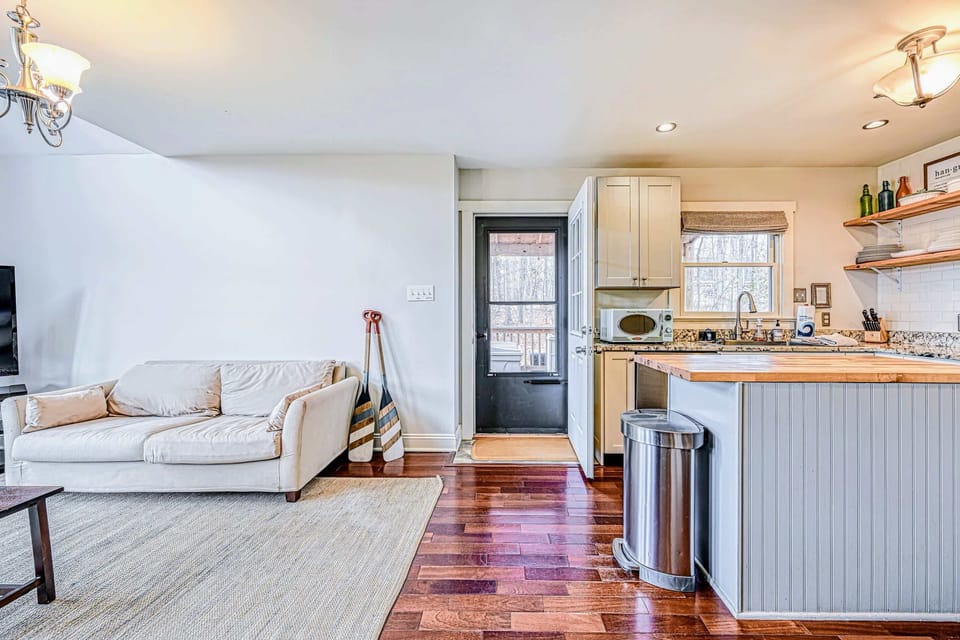 Great Room - An open layout flows from living to kitchen, the center of the trip for the whole group.