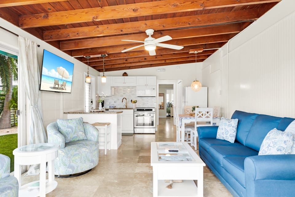 The living room offers a comfortable place to unwind with family or friends after enjoying the private dock, tiki hut, Cabana Club pool, and nearby Florida Keys attractions.