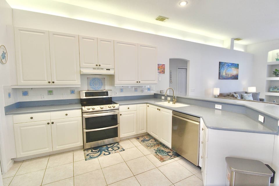The kitchen boasts a large counter area with plenty of space for all your prepping and cooking.