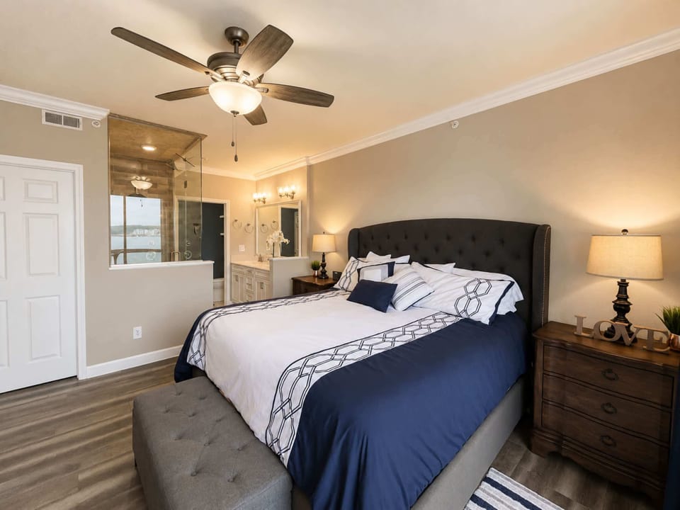 The elegant king suite boasts a smart TV, private ensuite, & balcony access​