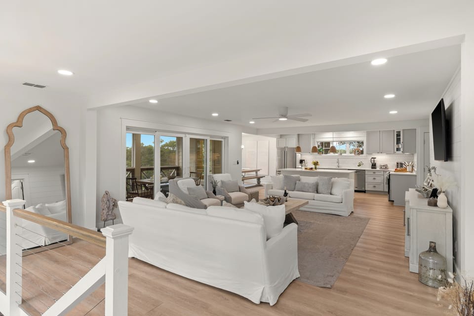 An expansive second-floor living area provides a wonderful secondary space for guests to relax. (Second-level)