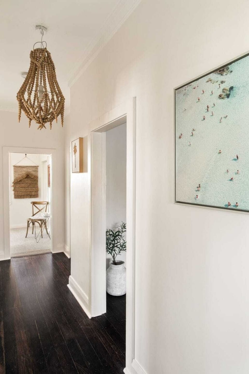 Stylish wood floors meet beachy decor, inviting you to explore coastal charm!