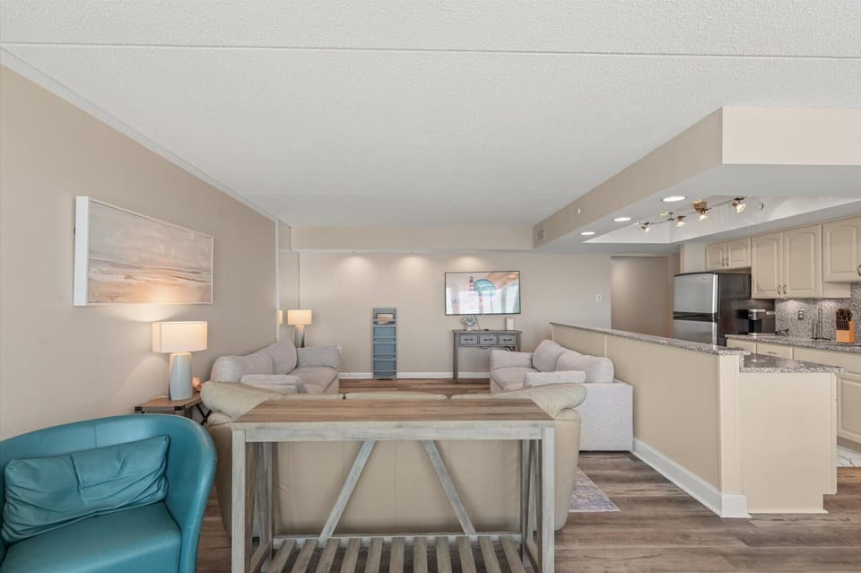 An open-concept design allows you to look right across the main living areas from the kitchen and dining entryway.