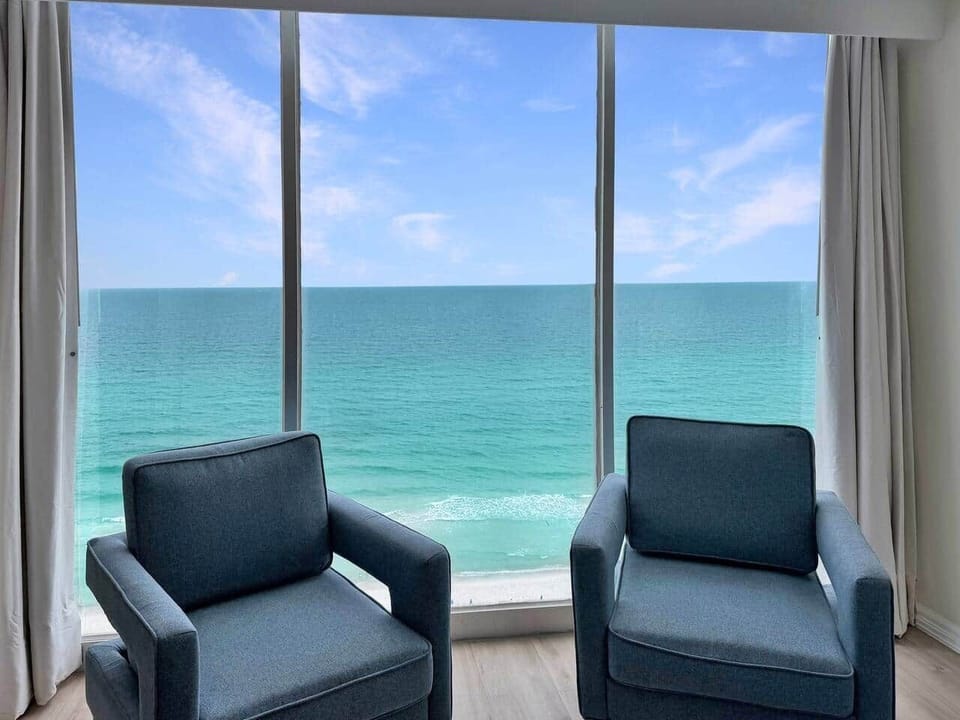 enjoy morning coffee or afternoon cocktail with floor to ceiling windows