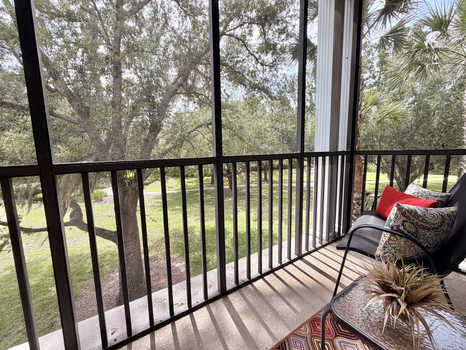 Relaxing covered patio and balcony attached to primary bedroom.