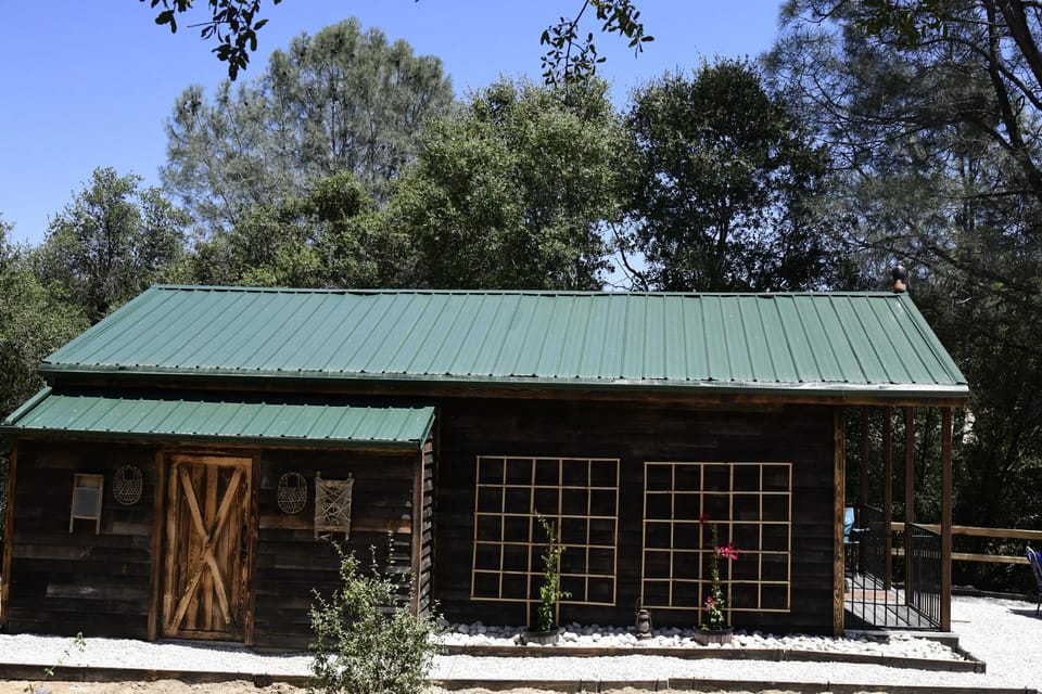 Charming ranch cabin surrounded by peaceful natural beauty.