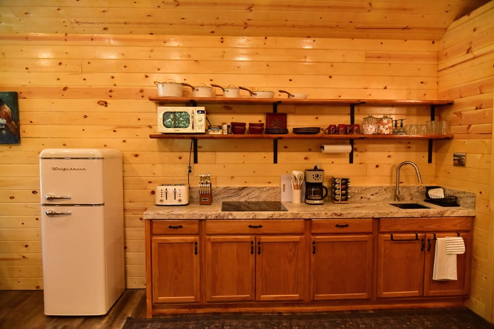 Fully equipped kitchenette with rustic ranch charm.