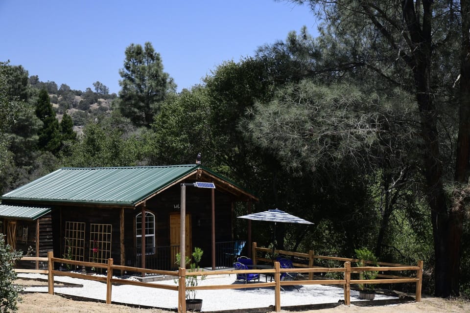 Lush greenery and peaceful countryside surround the property.