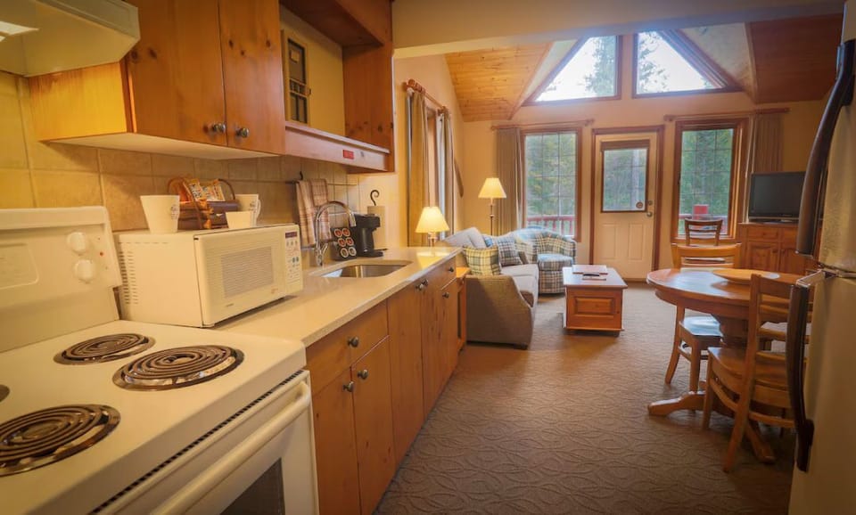 Cook up a storm in the fully-equipped kitchen, with modern appliances and inviting wooden cabinetry.