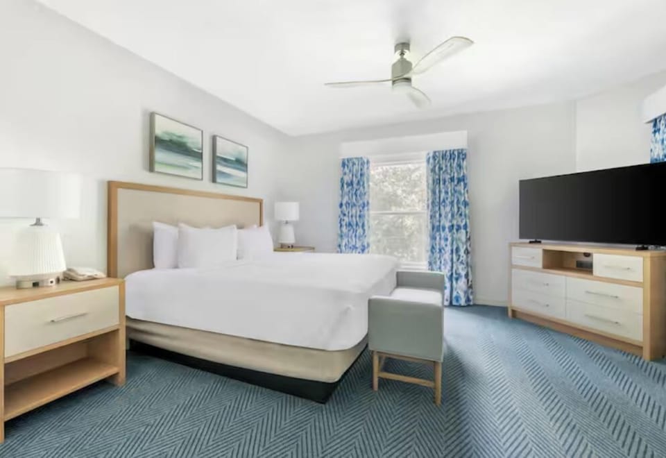 Wake up refreshed in a calm room with sunny window views.
