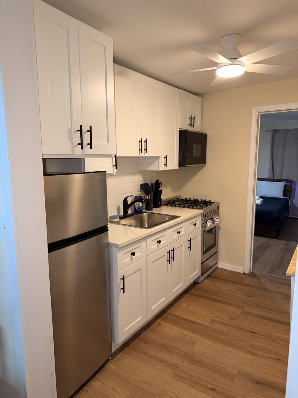 Bright modern kitchen with stainless appliances and ample cabinet storage