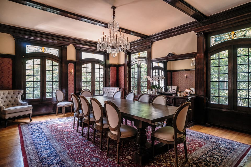 Elegant formal dining room with chandelier and seating for large groups