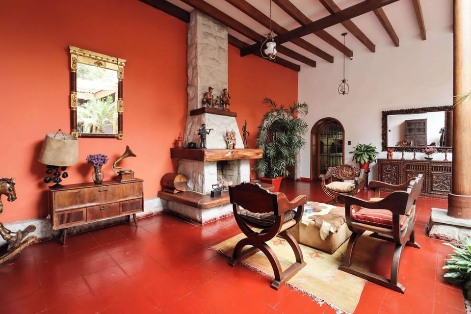 Elegant sitting room featuring a fireplace and timeless décor.