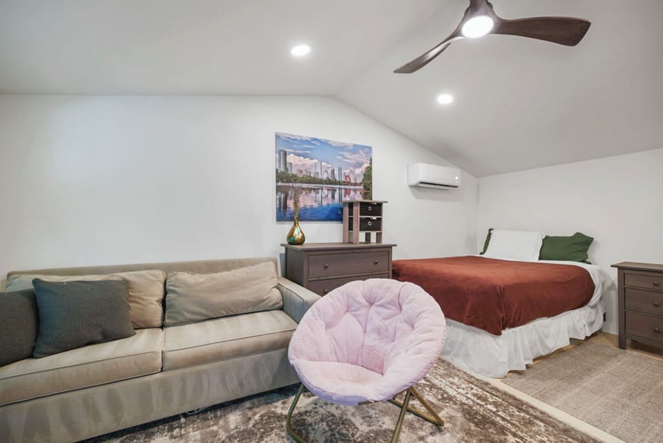 Cozy studio space with a queen bed and a pull-out sofa, perfect for couples or small groups