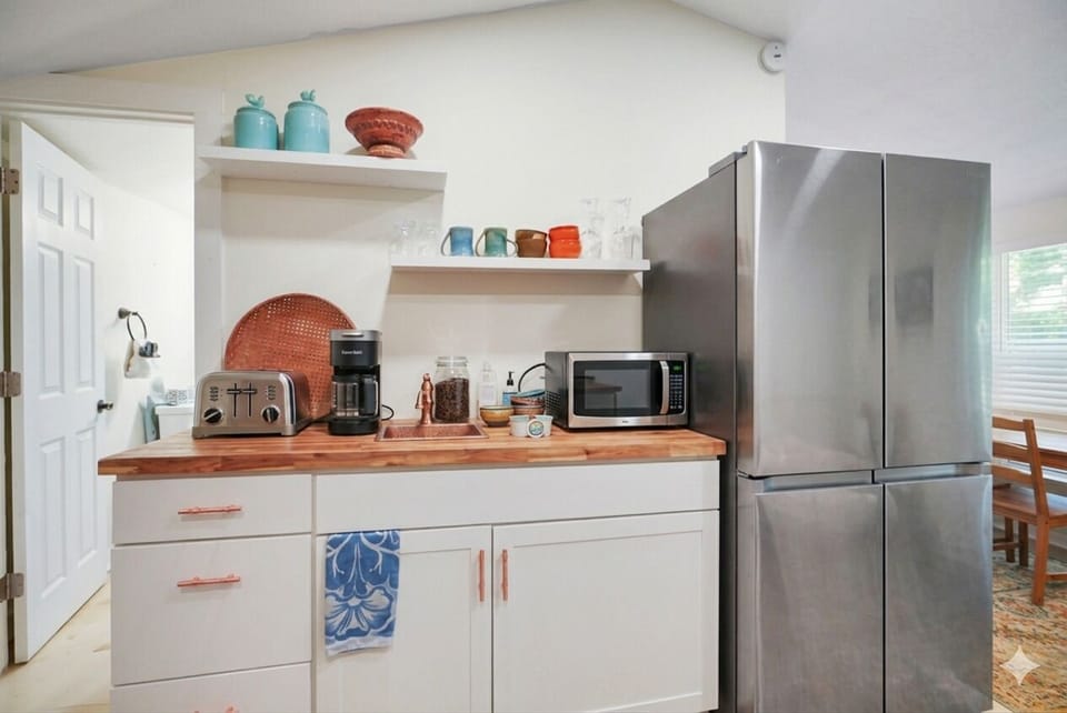 Kitchen with Modern Amenities • Everything you need for a comfortable stay. Microwave, Grill, Toaster. Big Frig