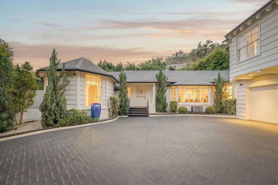 Arrive in style with a gated motor court and parking for five vehicles.