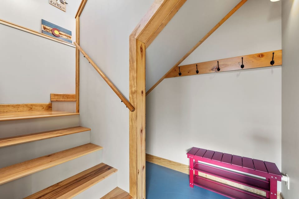 Easy access between floors with convenient space for shoes, coats, and gear.