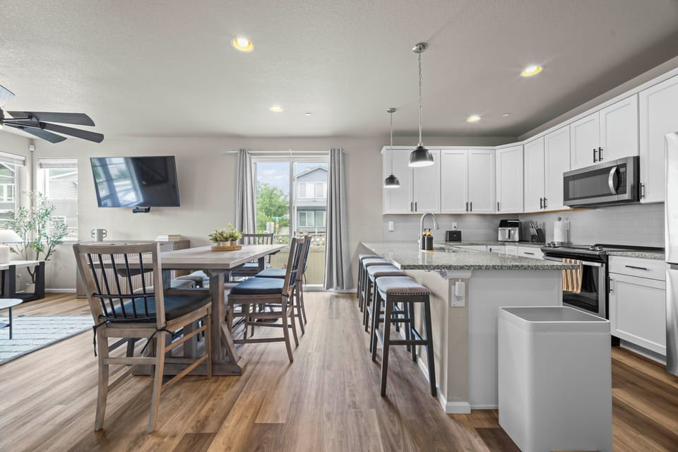 Gather around the dining table for meals, games, and conversation.