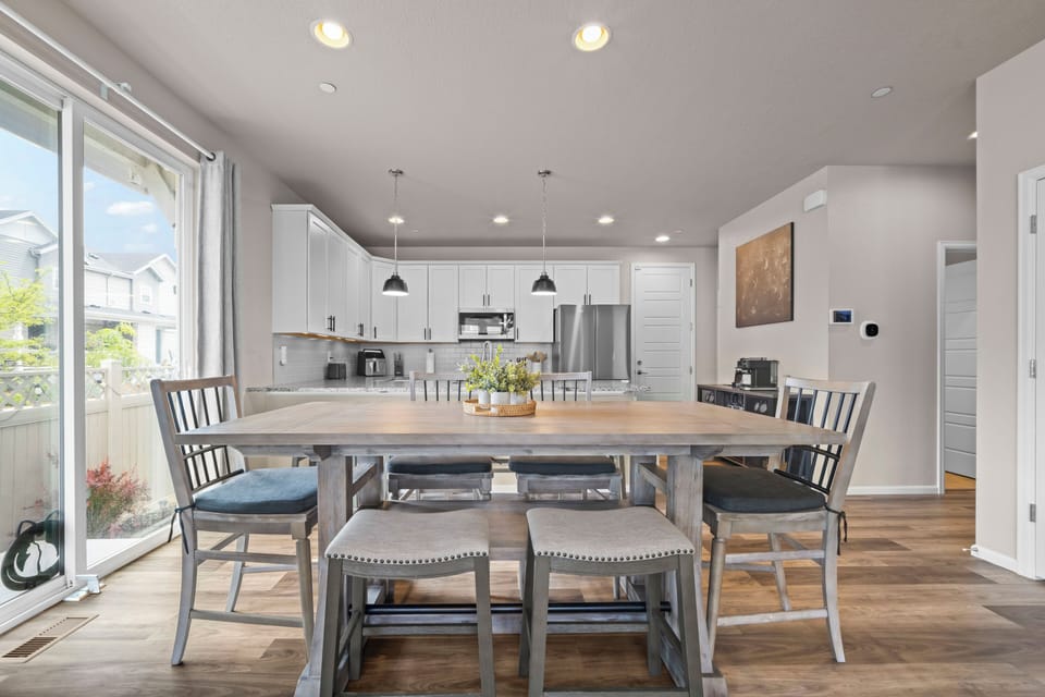 Enjoy meals together in a bright dining space beside the kitchen.