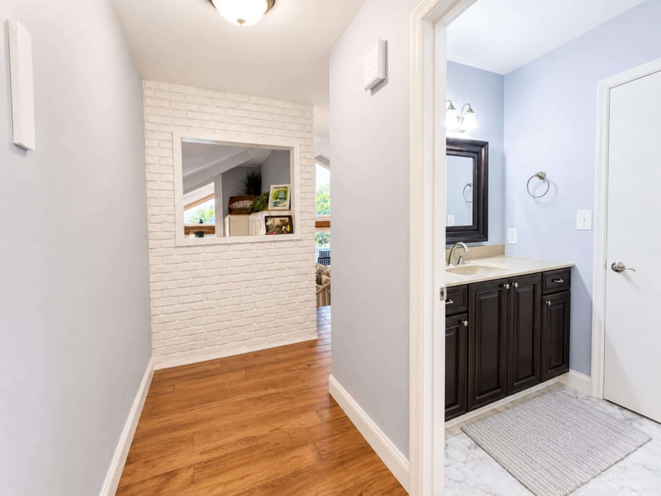 Access to this full bath is available just off the entry​