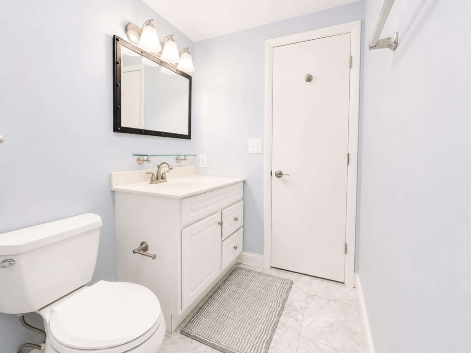 A single vanity & shower/tub combo await in this ensuite bath​